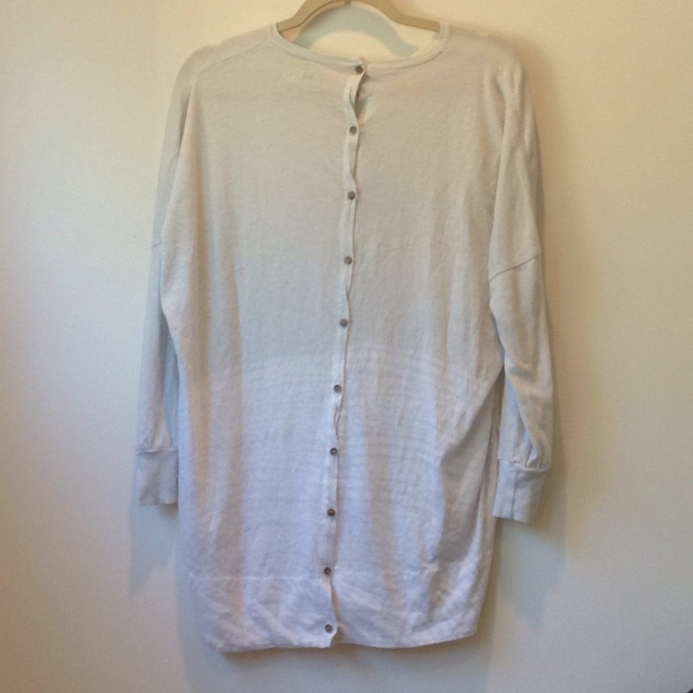 Cream button-down cardigan.